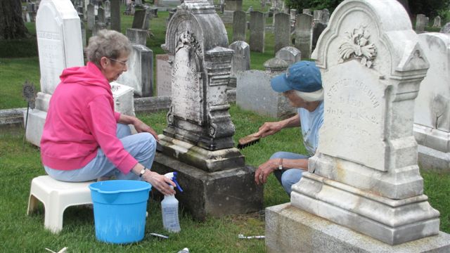 Ruth Blood demonstrating proper gravestone cleanin